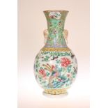 A CHINESE FAMILLE ROSE BOTTLE VASE, enamel painted with phoenix, birds and flowers. 36.