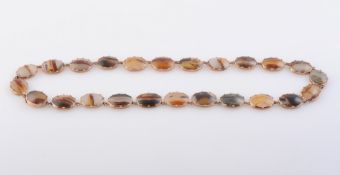 AN AGATE NECKLACE, CIRCA 1880-1890, formed of twenty-four oval polished cut banded and moss agates,