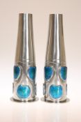 ARCHIBALD KNOX (1864-1933) FOR LIBERTY & CO A FINE PAIR OF TUDRIC PEWTER AND ENAMEL VASES, NOS.
