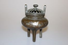 A CHINESE INLAID BRONZE CENSER, on a tripod base, inlaid with silver wire,