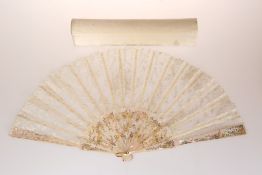 A MOTHER-OF-PEARL AND LACE FAN, in a Duvelleroy box.