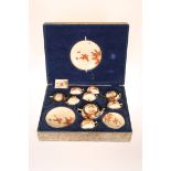 A JAPANESE SATSUMA TEA SERVICE IN A FITTED CASE, EARLY 20TH CENTURY, probably Kozan,