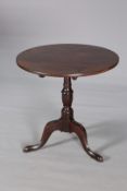 A GEORGE III MAHOGANY TILT-TOP TRIPOD TABLE, with baluster stem,