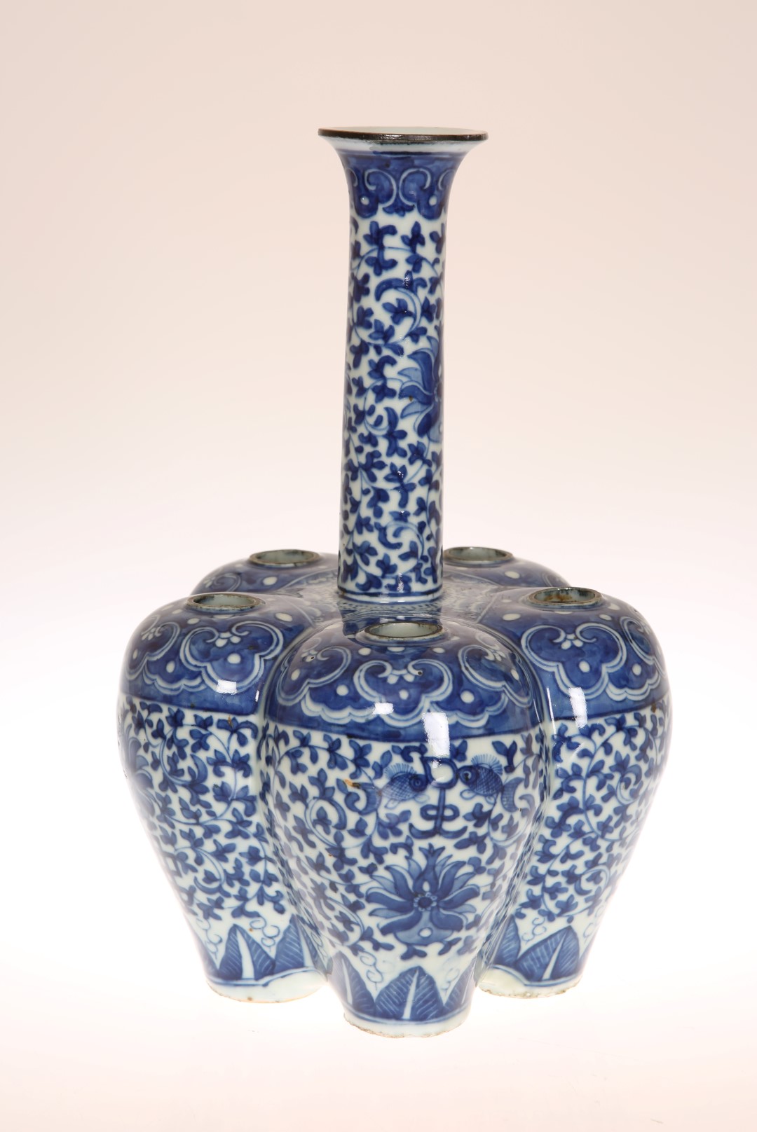 A CHINESE BLUE AND WHITE CROCUS VASE, probably 19th Century, painted with formal scrolling lotus.
