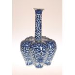 A CHINESE BLUE AND WHITE CROCUS VASE, probably 19th Century, painted with formal scrolling lotus.