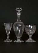 A GROUP OF GLASS COMPRISING: a flask-form decanter,