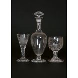 A GROUP OF GLASS COMPRISING: a flask-form decanter,