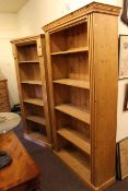 Two similar pine open bookcases