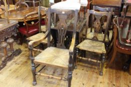 Oak gate leg dining table and five rush seated dining chairs