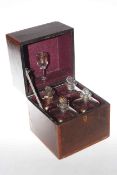 Antique inlaid mahogany box with four gilt decorated decanters
