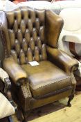 Leather deep buttoned back wing armchair