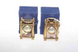 Two Omega miniature carriage clocks with decorated panels