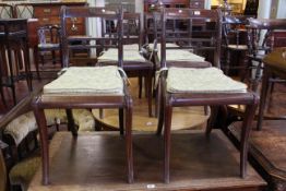 Set of six Regency rosewood bar back dining chairs on sabre legs
