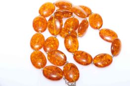 Large amber coloured bead necklace,