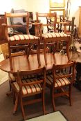 Mahogany twin pedestal extending dining table and six sabre leg chairs