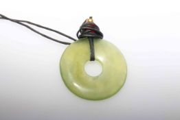 Green hardstone pendant with pierced centre