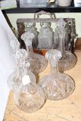 Three bottle walnut tantalus and five glass decanters