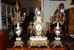 Ornate gilt metal and marble three piece clock garniture