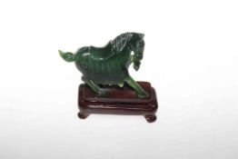 Nephrite jade dark green hand carved horse figurine, with certificate, on stand, 8.
