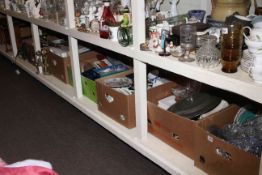 Full shelf of glass, china, collectors plates, metalwares, fire irons and dogs,