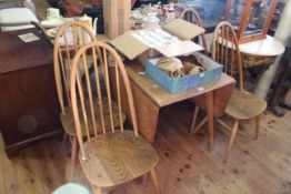 Vintage Ercol drop leaf dining table and four Quaker back chairs