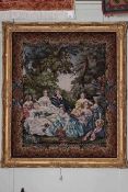 Large gilt framed needlework depicting ladies conversing in a garden,