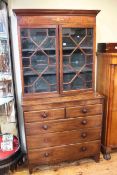 Victorian mahogany astragal glazed two door bookcase on a base of two short above three long
