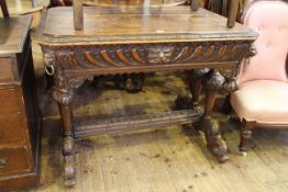 Victorian carved oak single drawer side table raised on turned pillars to carved dolphin feet,