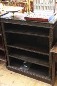 Victorian carved oak open bookcase having three adjustable shelves,
