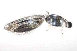 Silver sauce boat and pierced silver oval dish