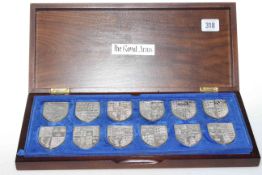 Cased set of twelve silver shield shaped Royal Coat of Arms