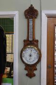 Late Victorian carved oak aneroid barometer, signed H.
