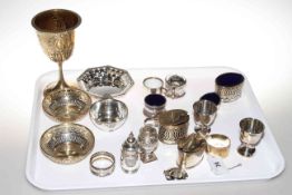 Tray of assorted silver including salts, pepperettes, egg cups, goblet, three pierced dishes,