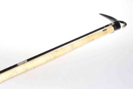 Chinese engraved bone sectional walking cane and an ebonised cane with white metal mounts, 85.