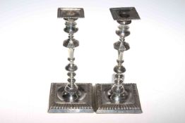Pair late Victorian silver candlesticks having gadroon border with square nozzle and base,