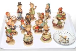 Collection of fourteen Hummel figures and pierced dish