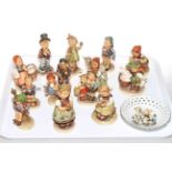 Collection of fourteen Hummel figures and pierced dish