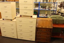 Five height and four height cream finish chests and pair of matching three height pedestal chests,