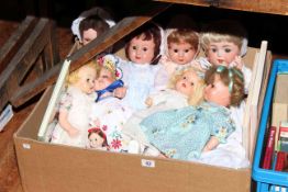 Box of dolls and books