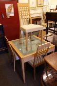 Modern glass top extending dining table with four chairs