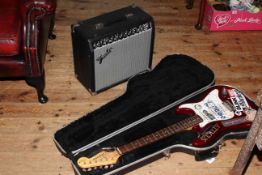 Fender amplifier and Tanglewood guitar with case