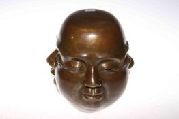 Chinese bronze of a head with four facial expressions,