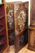 19th Century carved oak and stamped leather three-panel screen