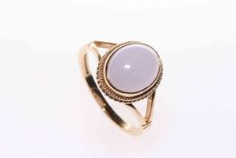 9 carat gold ring set with a lavender coloured stone,