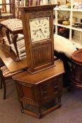 Oak Old Charm cupboard with canted corners and Old Charm linen fold wall clock