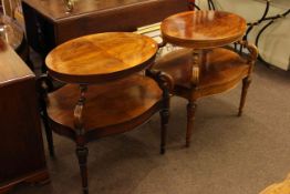 Pair of walnut two tier side tables,