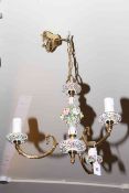 Brass and floral encrusted three branch light fitting and pair of wall lights
