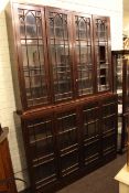 Two pine and glazed four door bookcases