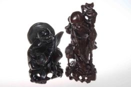 Two Chinese carved wood figures of happy men,
