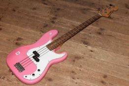 Pink and white electric guitar marked Westfield